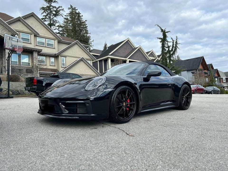 Black Porsche 911 convertible detailed to a deep gloss finish